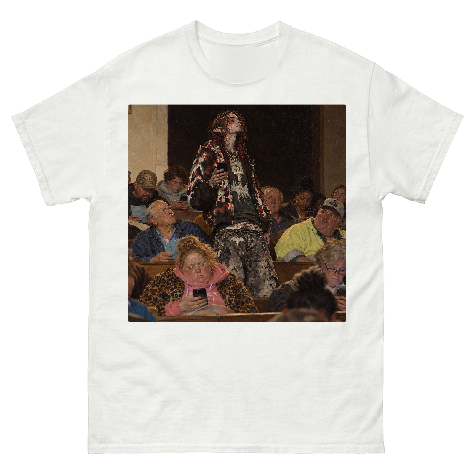 White tee with a painting on the front of a man standing, phone in hand, looking up in a room of people mostly looking at their phones